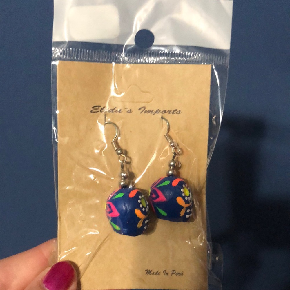Brand new sugar skull earrings still in package